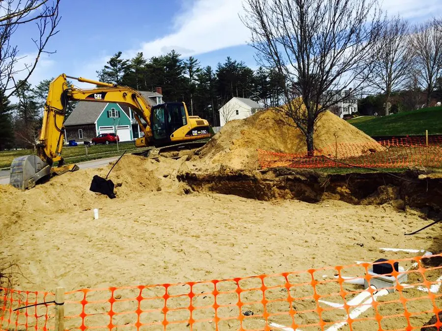 Excavator and fill pile on a residential lot